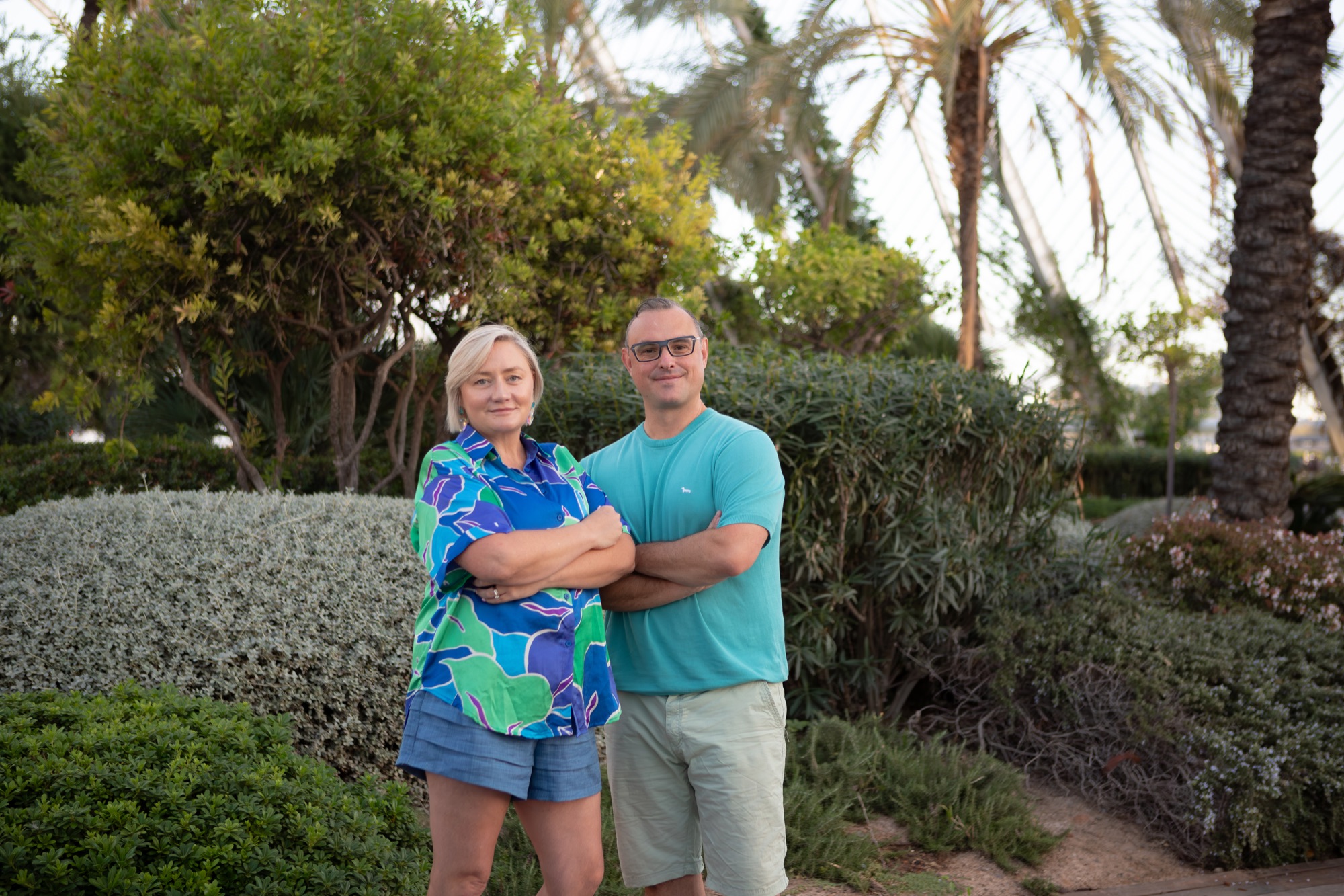 Tasch and Guy Turner standing side by side with arms folded, in a garden in Valencia